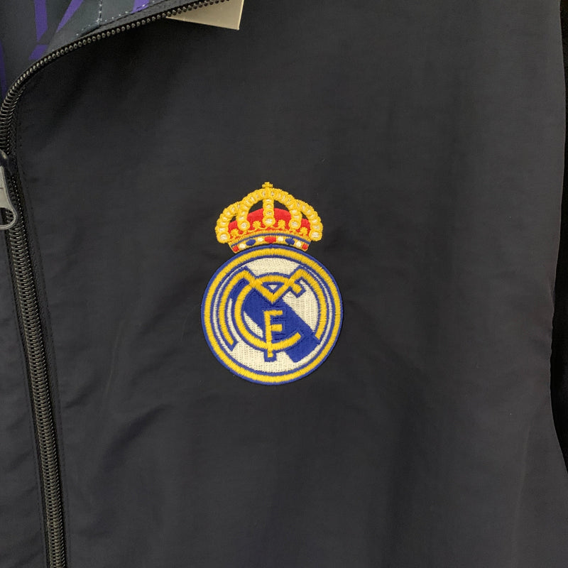 Jaqueta Corta Vento Real Madrid Dupla Face 2023/24 - Azul e Amarelo/ Escuro